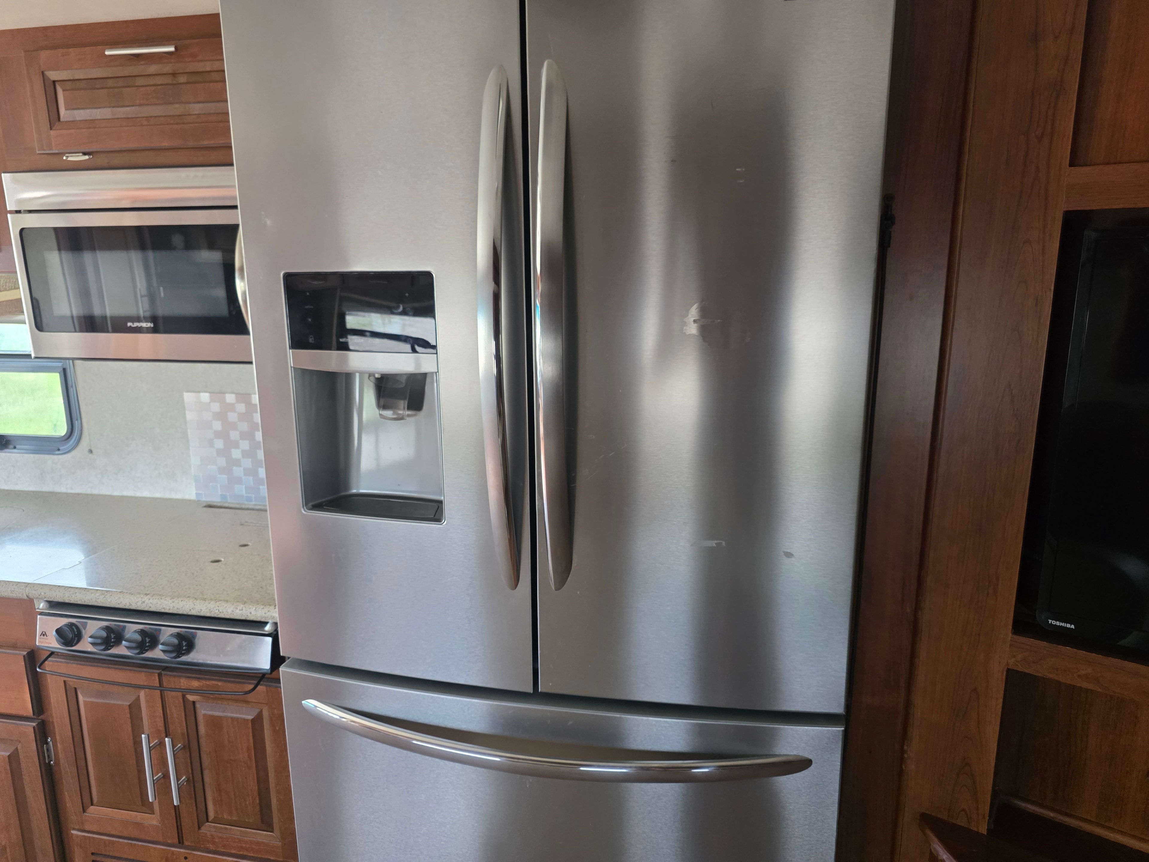 2014 Forest River Georgetown – large residential French door stainless refrigerator with ice and water dispenser