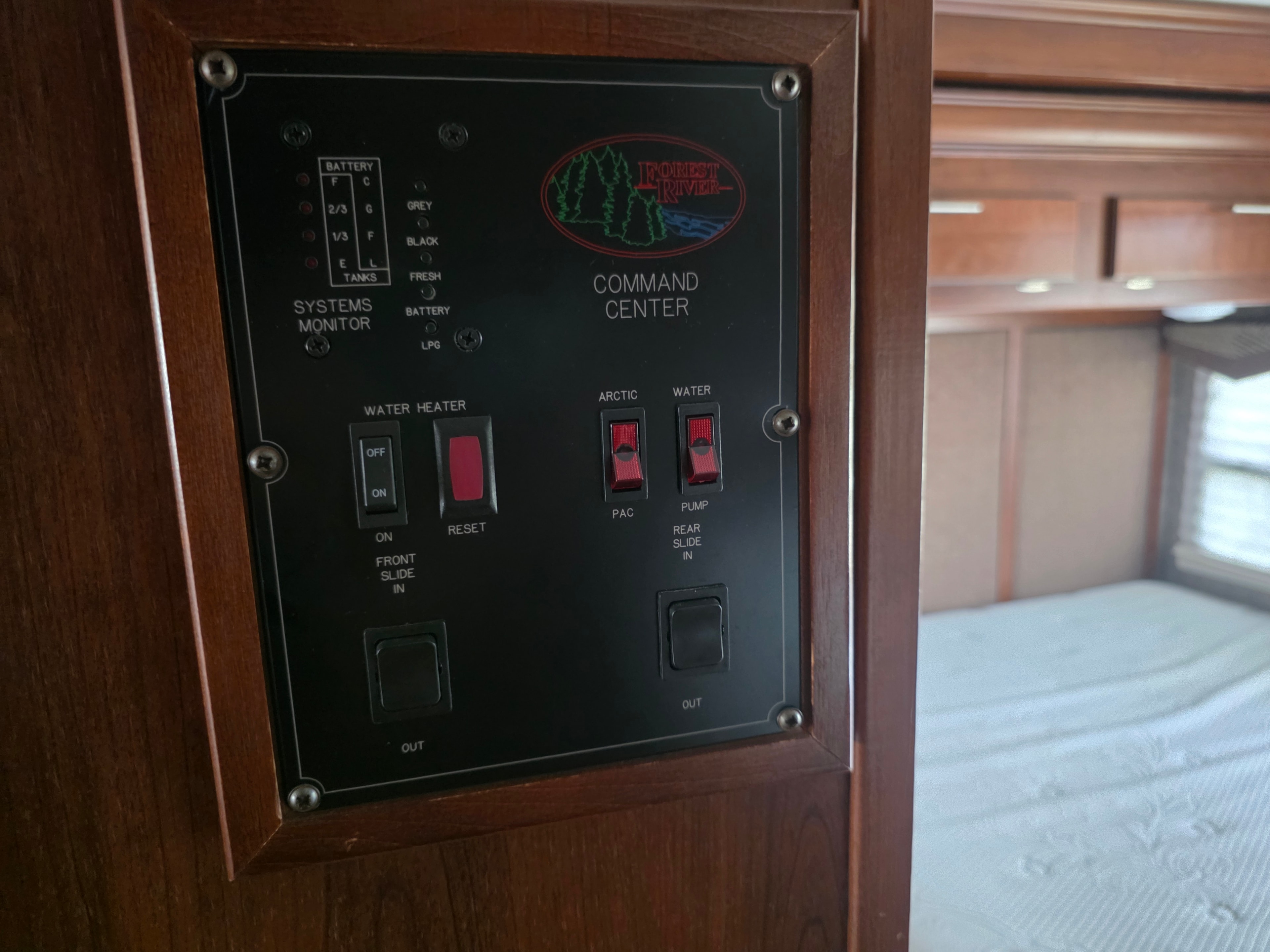 2014 Forest River Georgetown – Forest River Command Center panel with systems monitor, water heater, slide and water pump controls