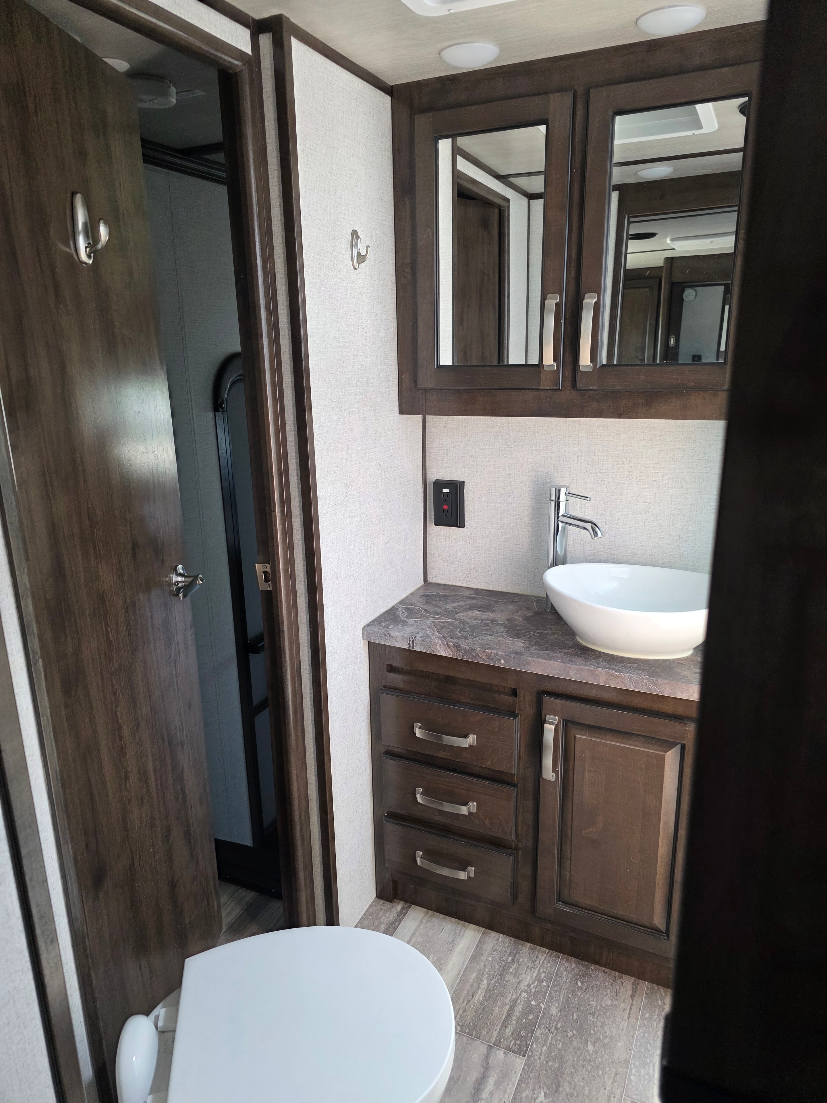 2021 Yukon Dutchmen 320RL – bathroom vanity with vessel sink, mirror, and under-counter drawer