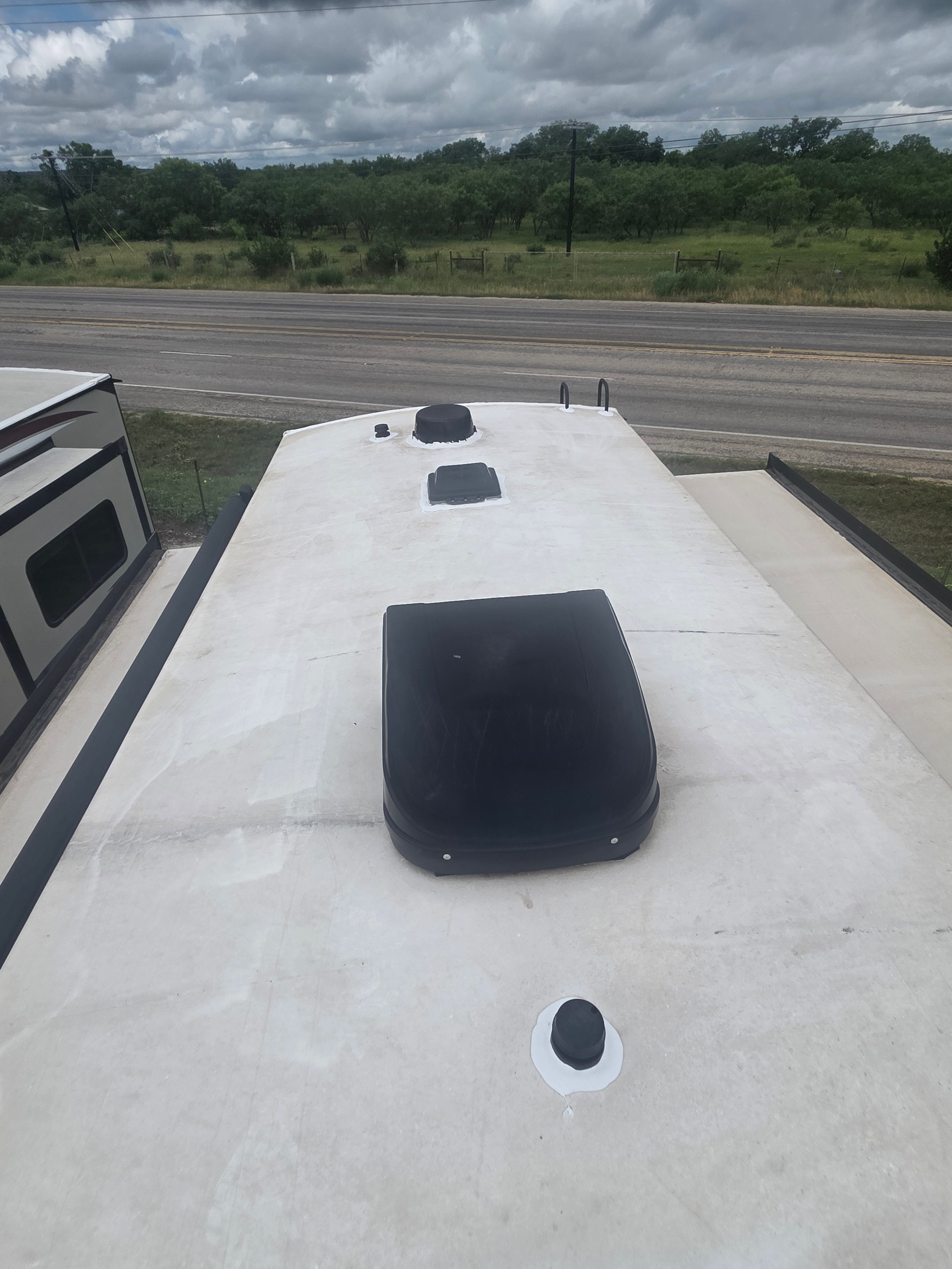 2022 Grand Design Imagine 2670MK – roof view showing single AC unit and recently recaulked seams