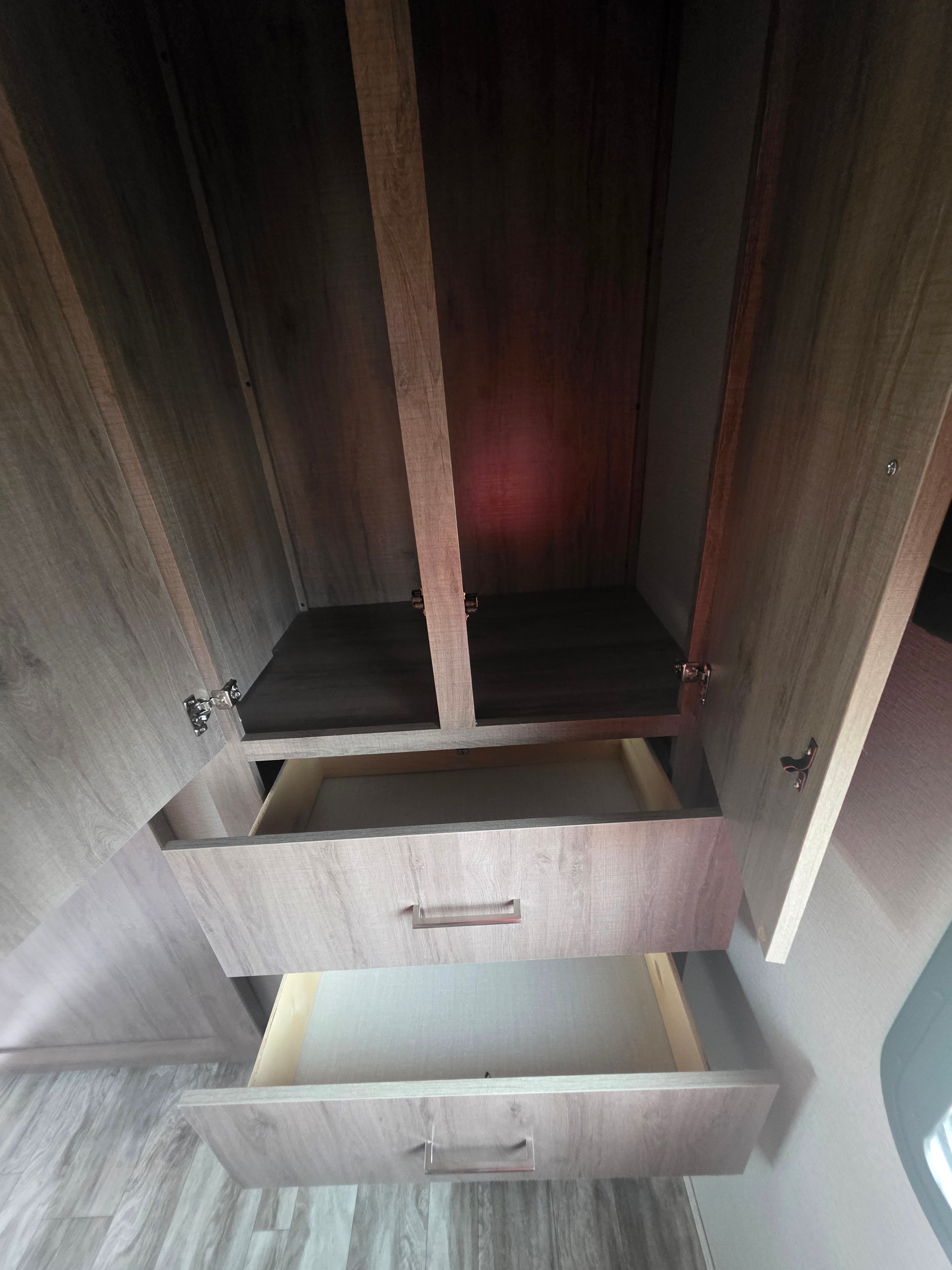 2022 Grand Design Imagine 2670MK – bedroom open wardrobe showing generous storage shelves and closet