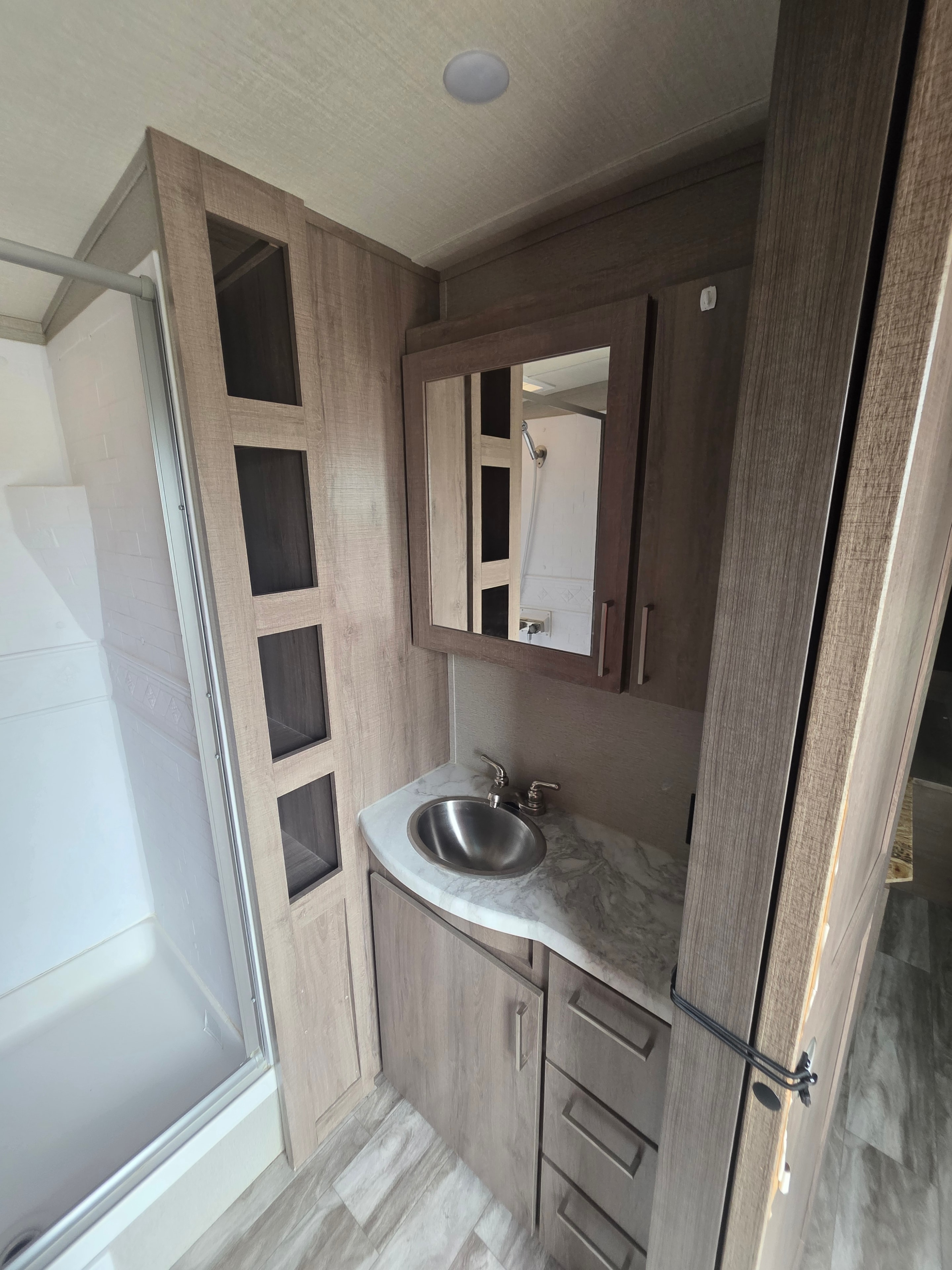 2022 Grand Design Imagine 2670MK – bathroom vanity with round sink, marble countertop, mirror cabinet and shower door