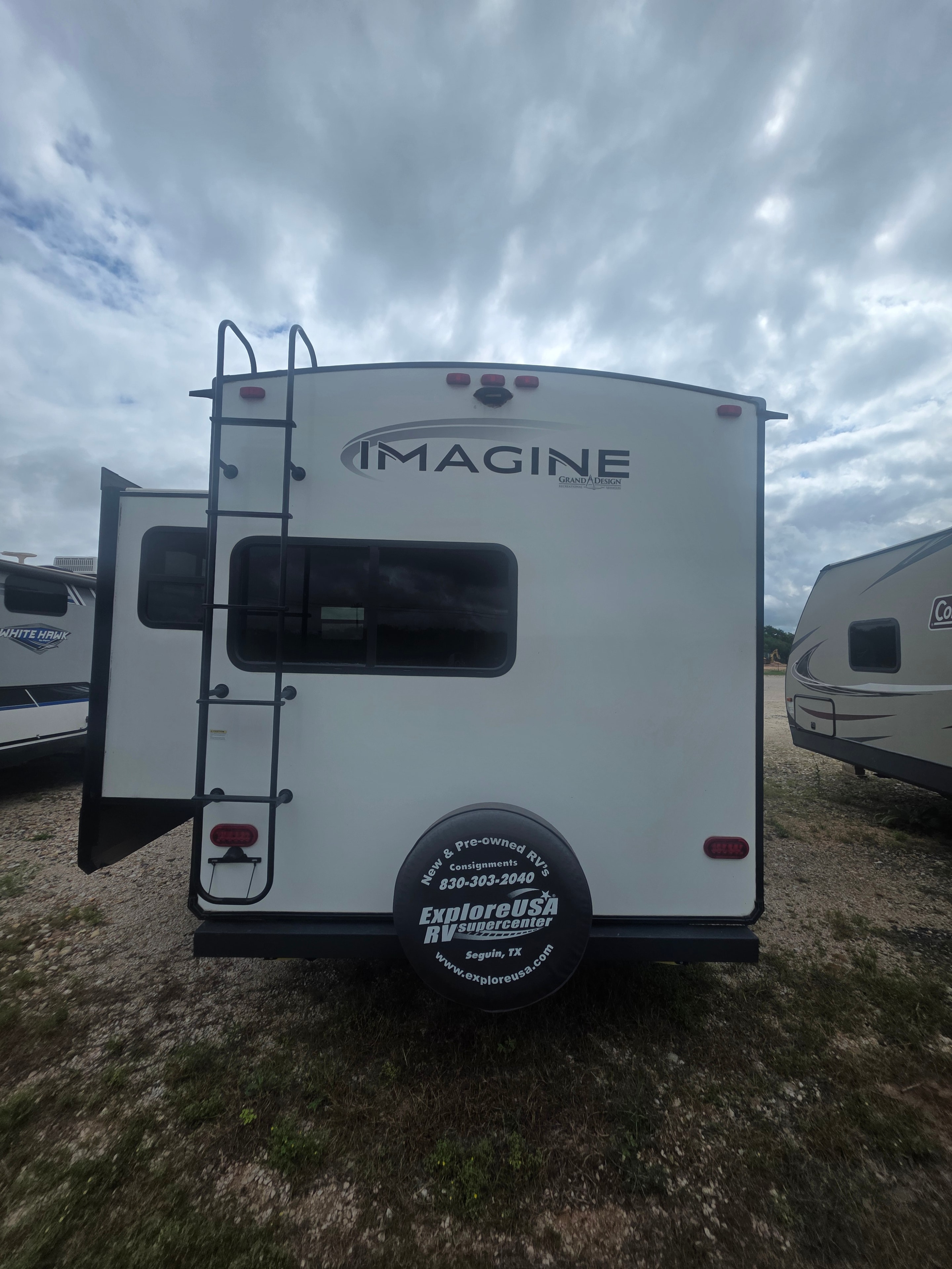 2022 Grand Design Imagine 2670MK – rear cap with Imagine Grand Design badge and spare tire cover