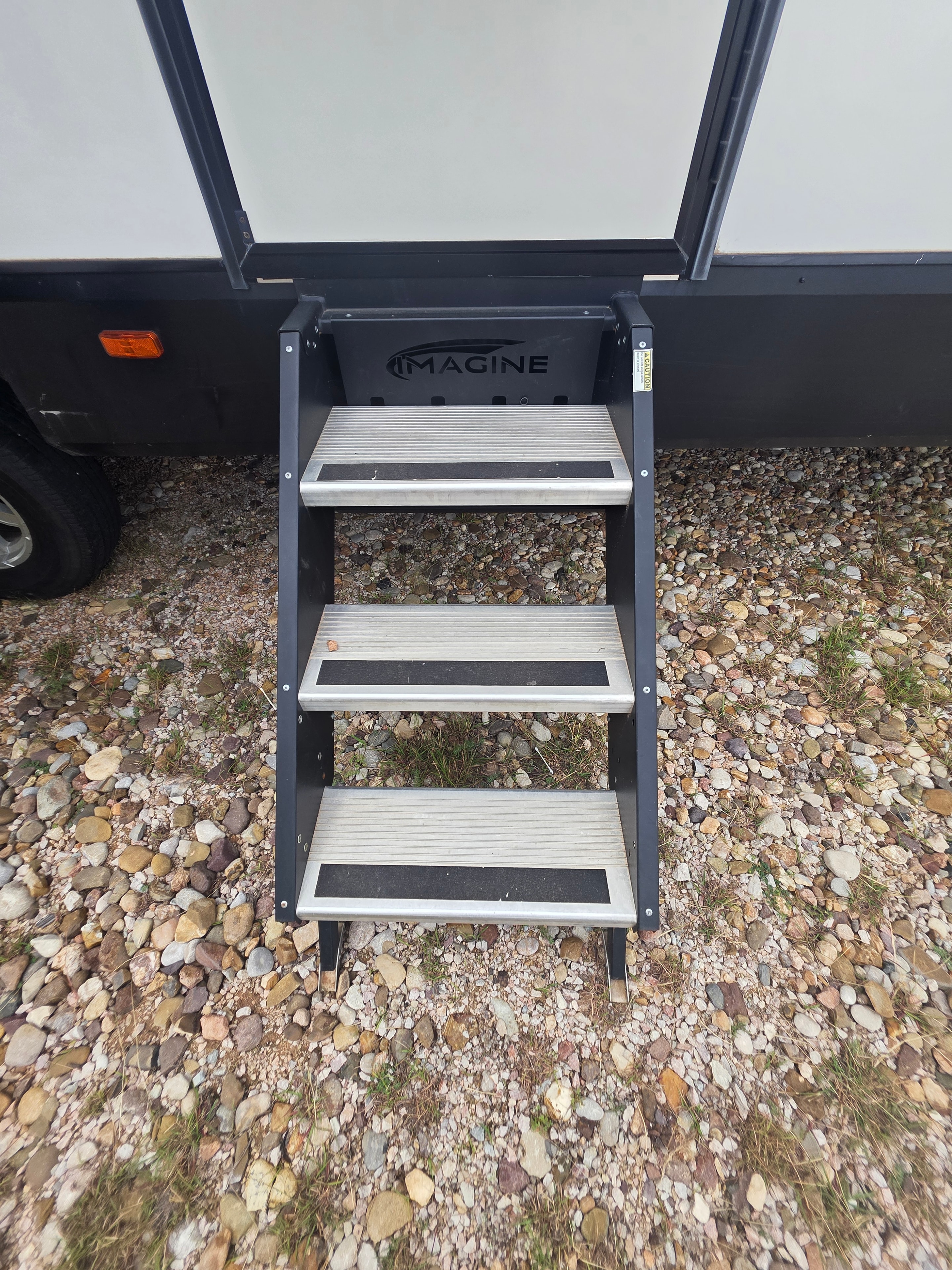 2022 Grand Design Imagine 2670MK – Imagine-branded 3-step entry stairs with non-slip treads and entry door