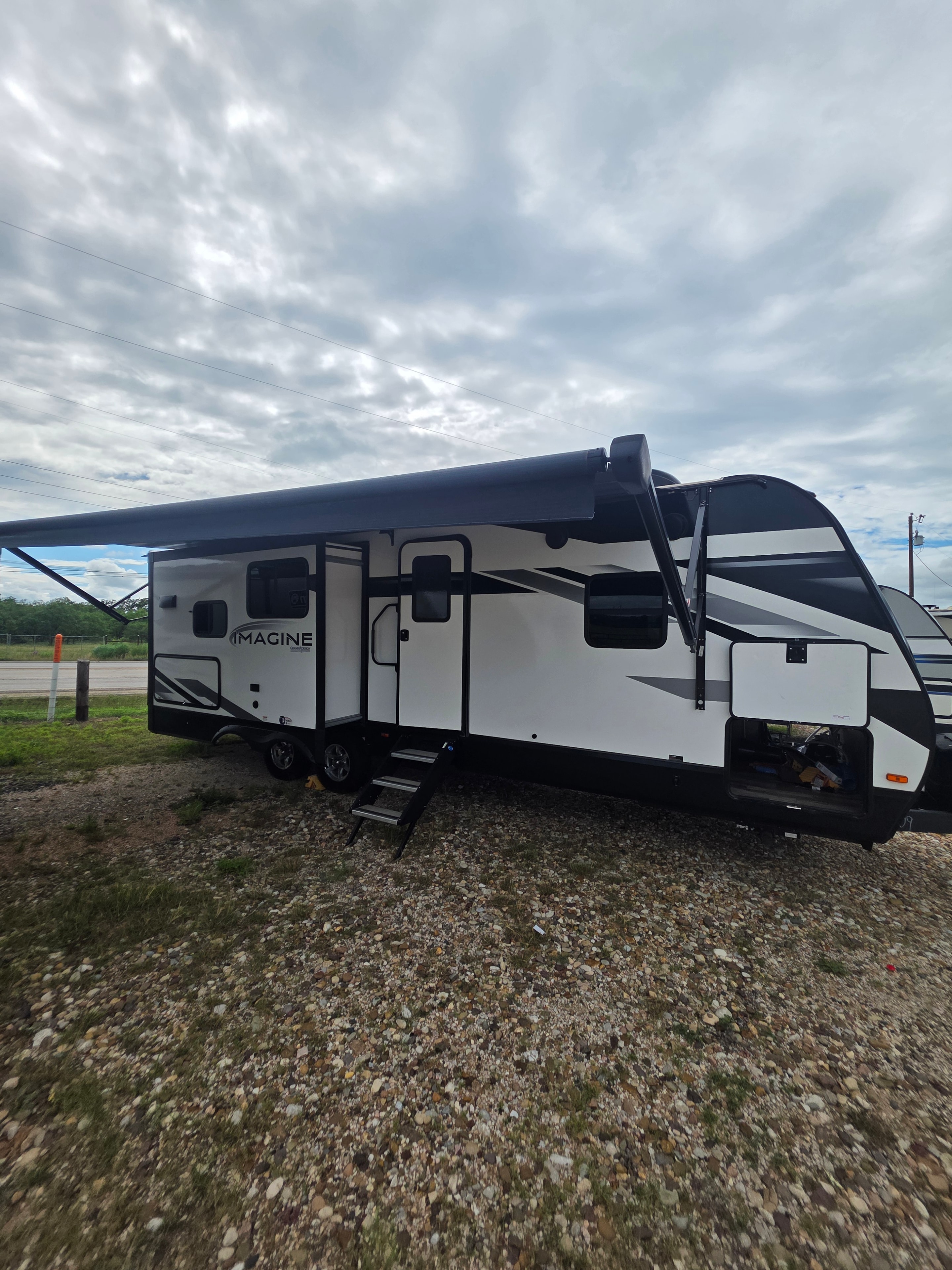 2022 Grand Design Imagine 2670MK – full driver side exterior with opposing slides, Imagine badge and electric awning