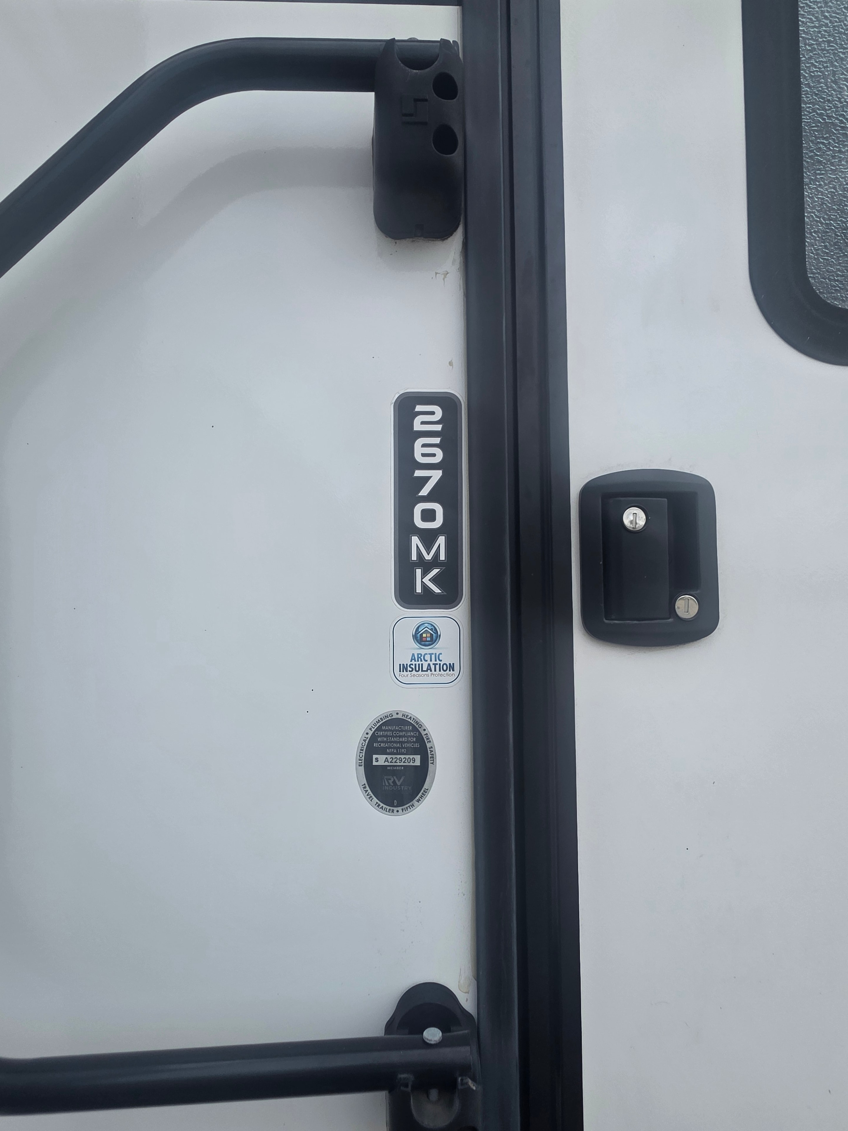 2022 Grand Design Imagine 2670MK – 2670MK model badge, Arctic Insulation sticker and RVIA compliance label