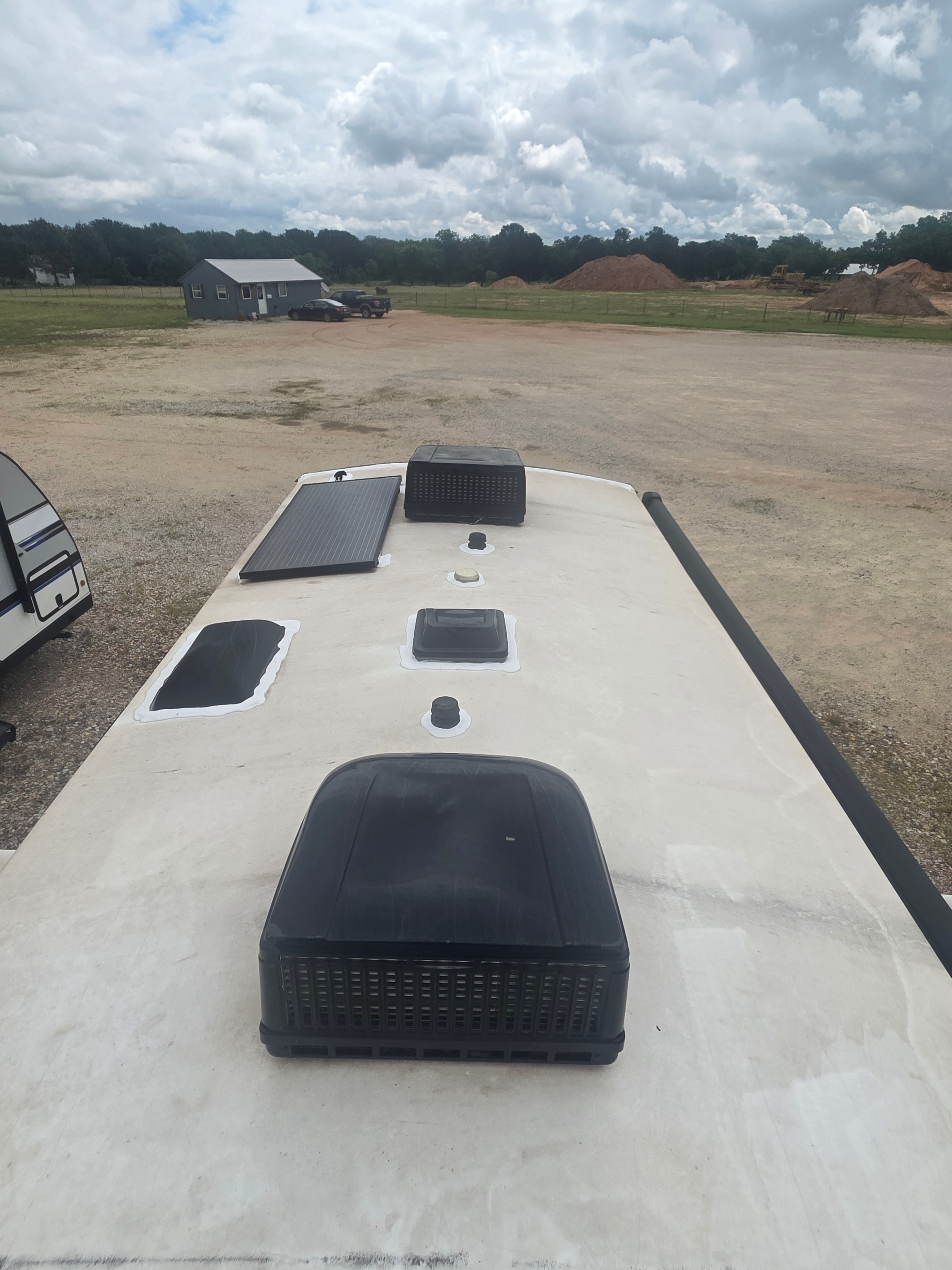 2022 Grand Design Imagine 2670MK – roof view showing solar panel, two AC units and vents